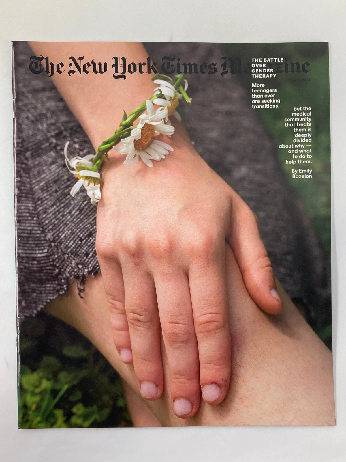 Cover of The New York Times Magazine, June 19, 2022, featuring an artistic image of a hand adorned with a floral bracelet, representing the theme of the issue titled 'The Battle Over Gender Therapy: No Label'