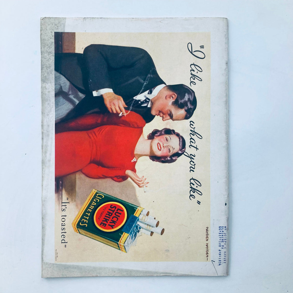 Vintage advertisement for Lucky Strike cigarettes, featuring a couple in a playful interaction, reflecting the 1930s marketing style.
