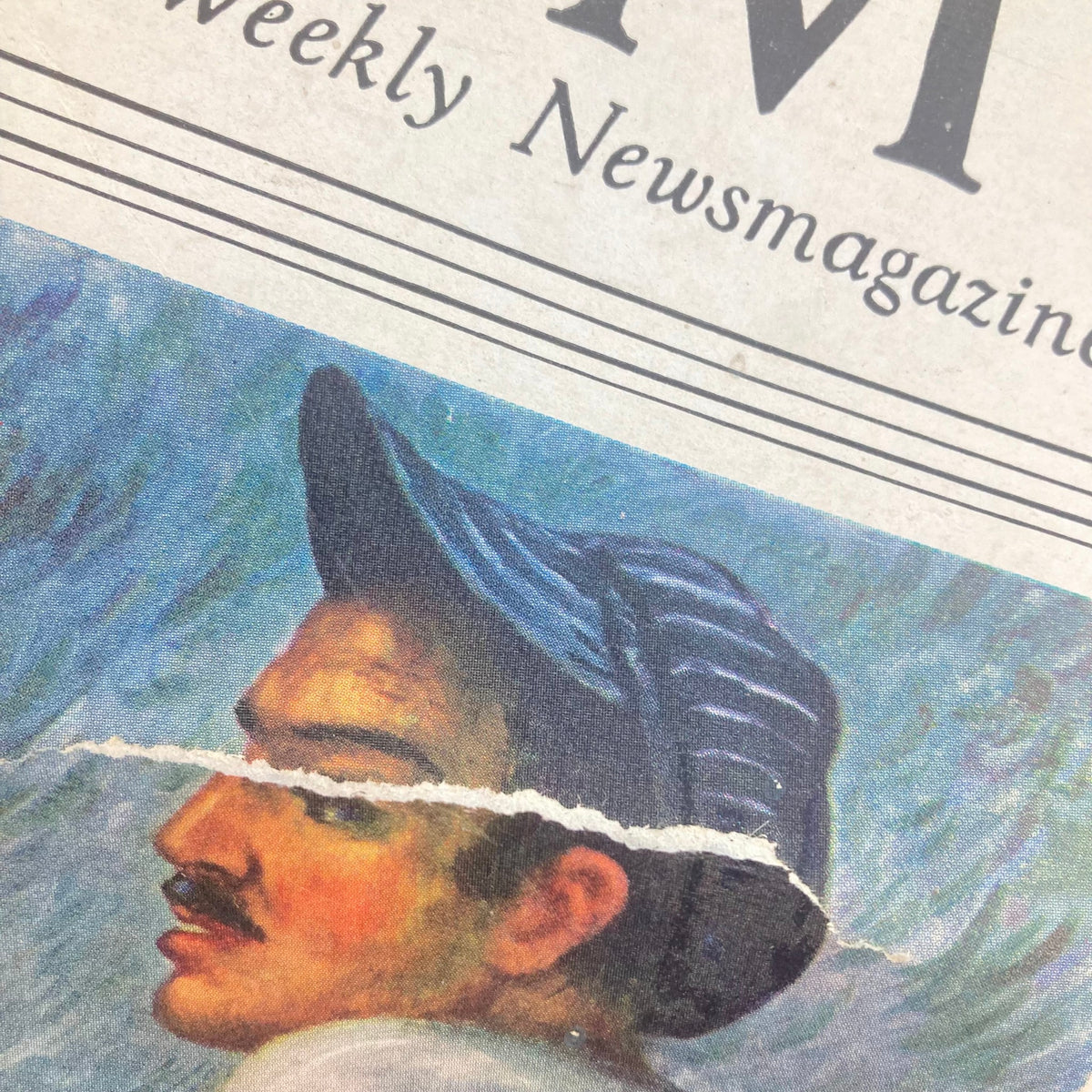 Close-up of the cover of VTG Time Magazine October 18 1937 featuring Ernest Hemingway, showing the image's wear with a tear and creases.