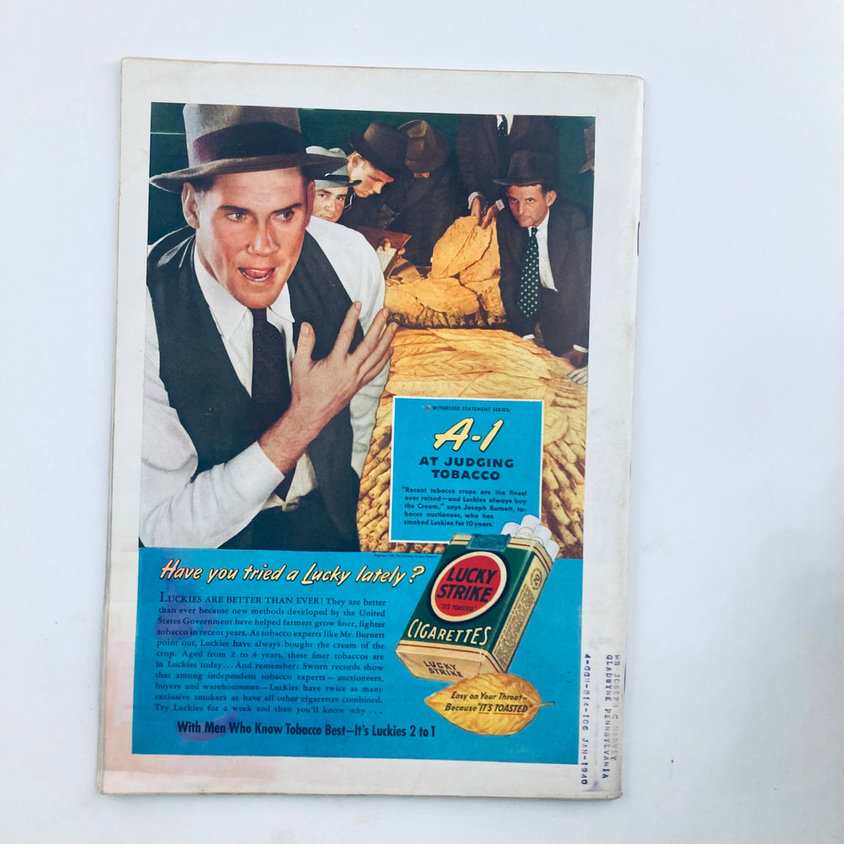 Back cover of VTG Time Magazine May 15, 1939, displaying a striking advertisement for Lucky Strike cigarettes, with an image of men evaluating tobacco.