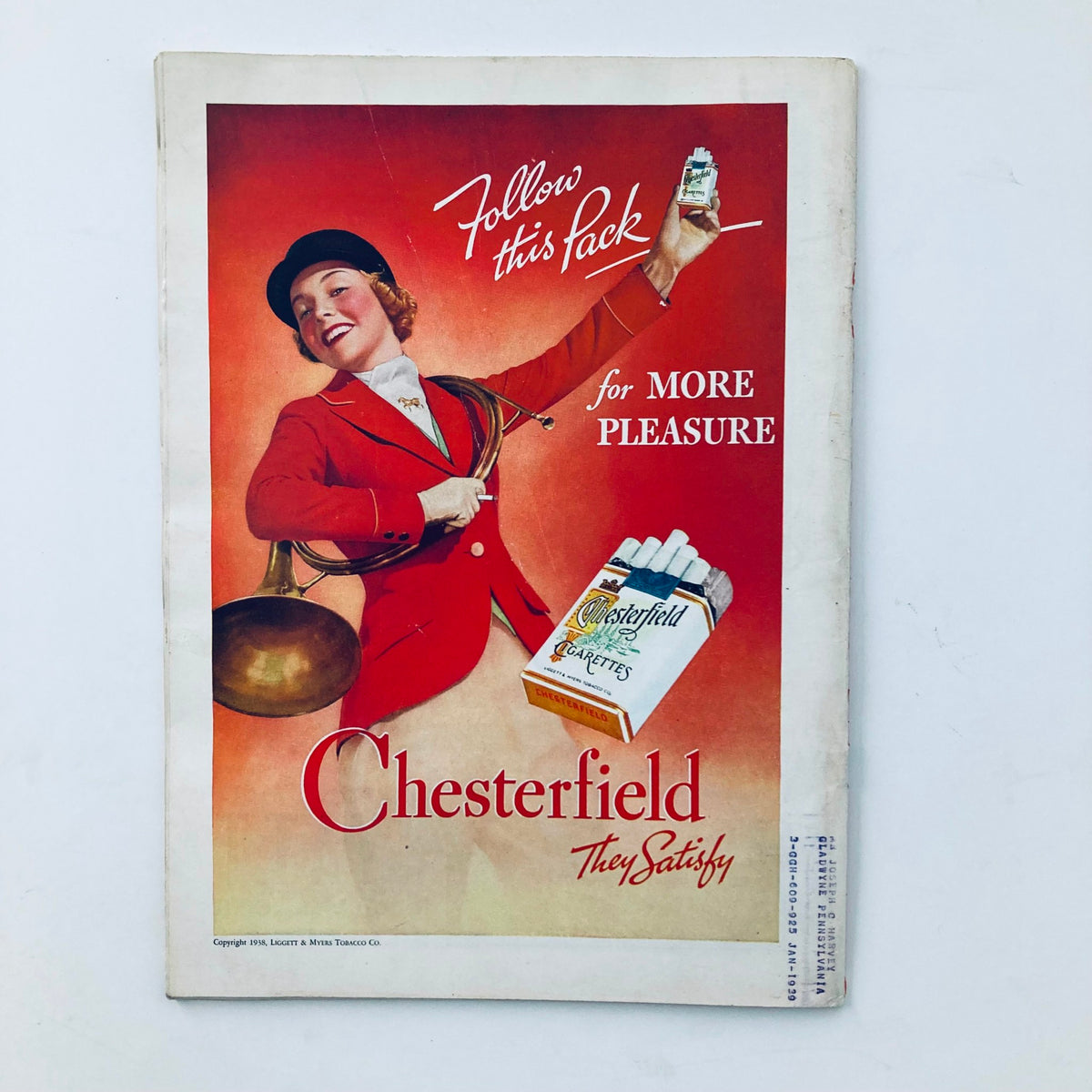 Vintage advertisement from the 1938 Time Magazine featuring a cheerful woman promoting Chesterfield cigarettes. The cover includes the phrase 'Follow this pack for more pleasure' alongside the brand's logo, set against a vibrant red background.