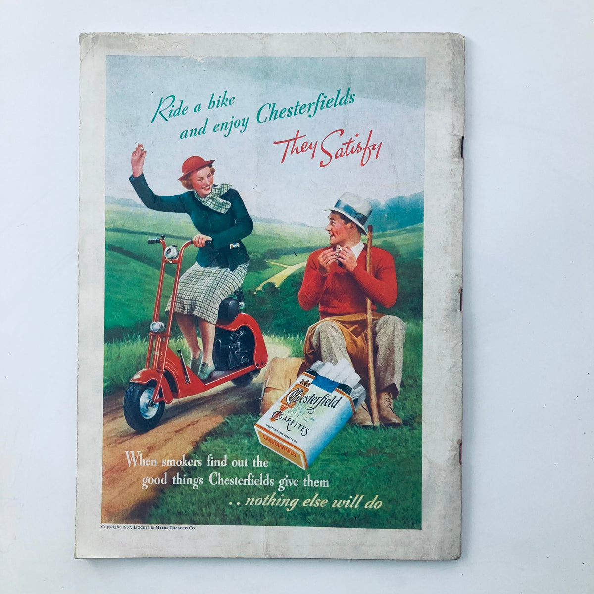 Advertisement from the April 5, 1937, Time Magazine promoting Chesterfield cigarettes. The colorful vintage design features a woman on a scooter and a man, highlighting leisure and lifestyle from the 1930s.