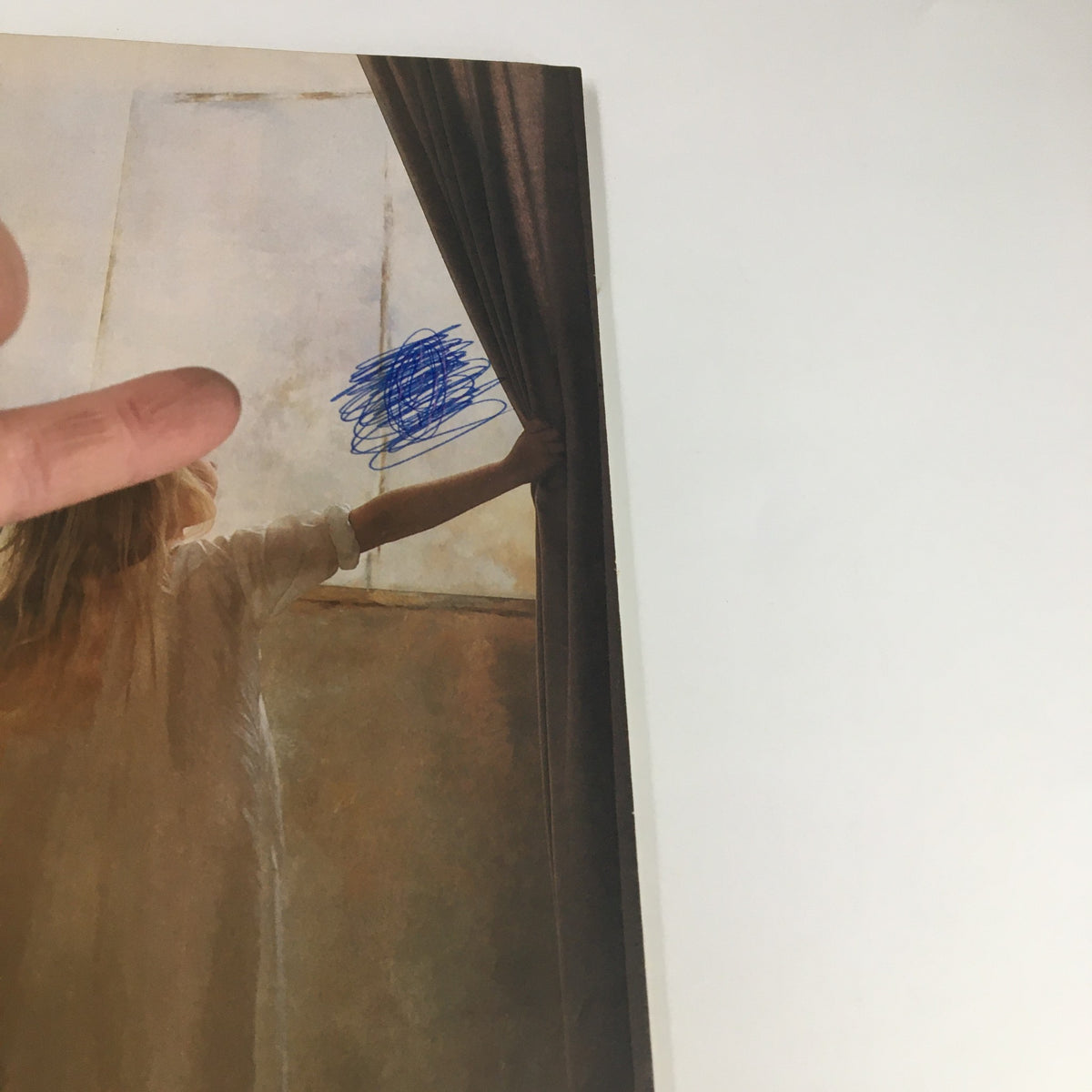 Interior page of The Saturday Evening Post September 1989 with a hand pointing at a partially visible image behind curtains, indicating wear.