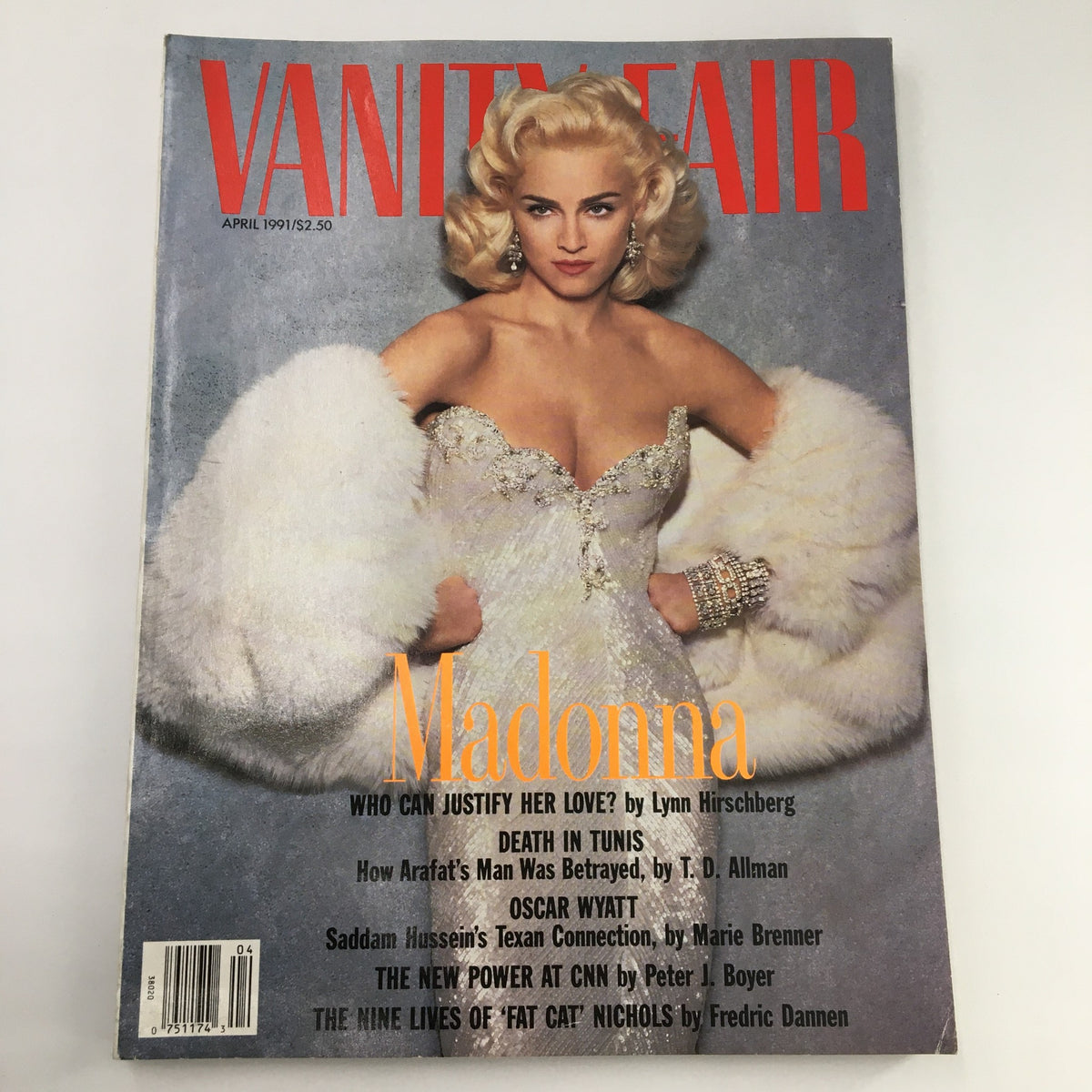 Cover of Vanity Fair Magazine, April 1991 featuring Madonna in glamorous attire, showcasing her iconic style. The magazine also includes features on Oscar Wyatt and events in Tunis, making it a collectible vintage item.