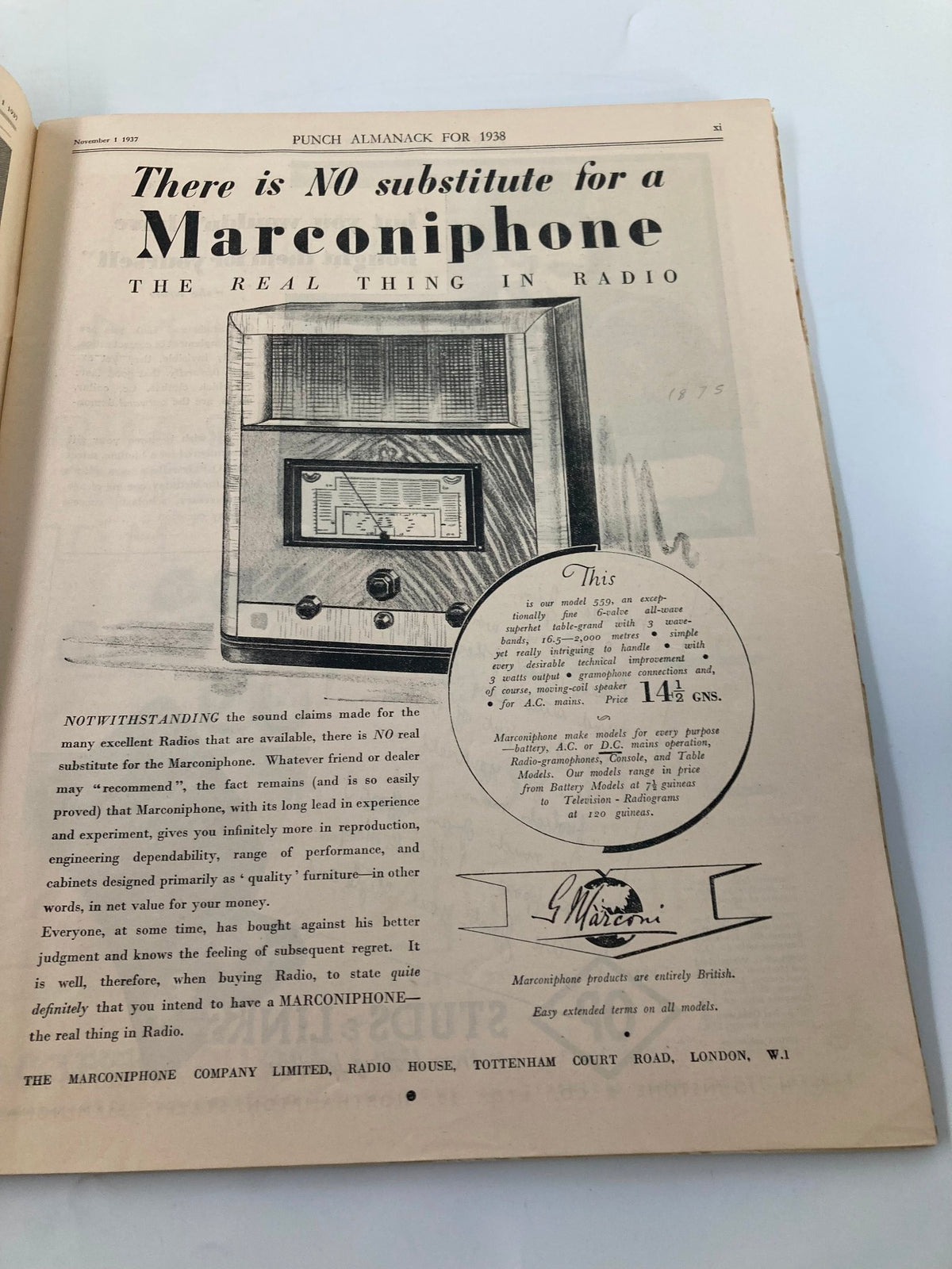 Inside page of VTG Punch Magazine November 1 1937 displaying an advertisement for a Marconiphone radio, highlighting vintage marketing with a classic radio illustration.