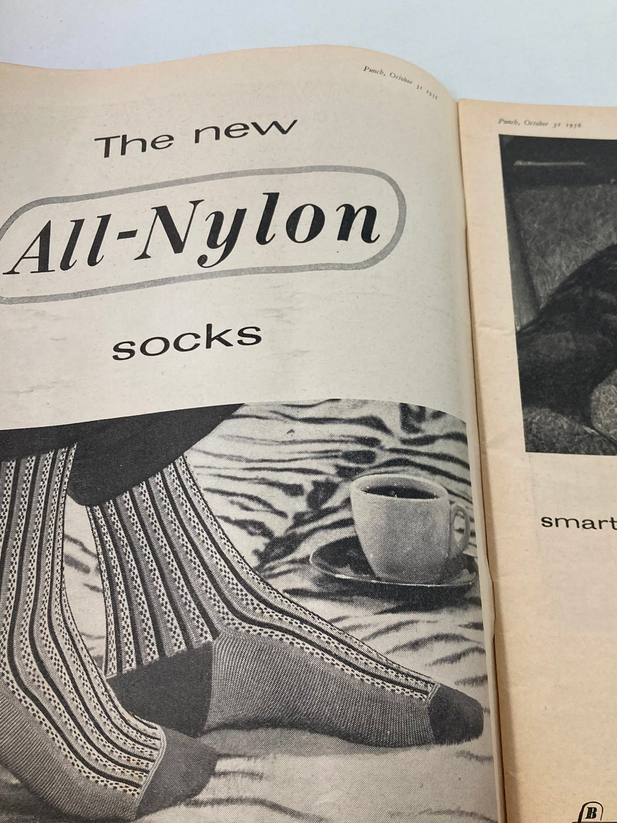 VTG Punch Magazine October 31 1956 featuring a vintage advertisement for 'The new All-Nylon socks' with styled socks displayed on a zebra print background and a coffee cup.
