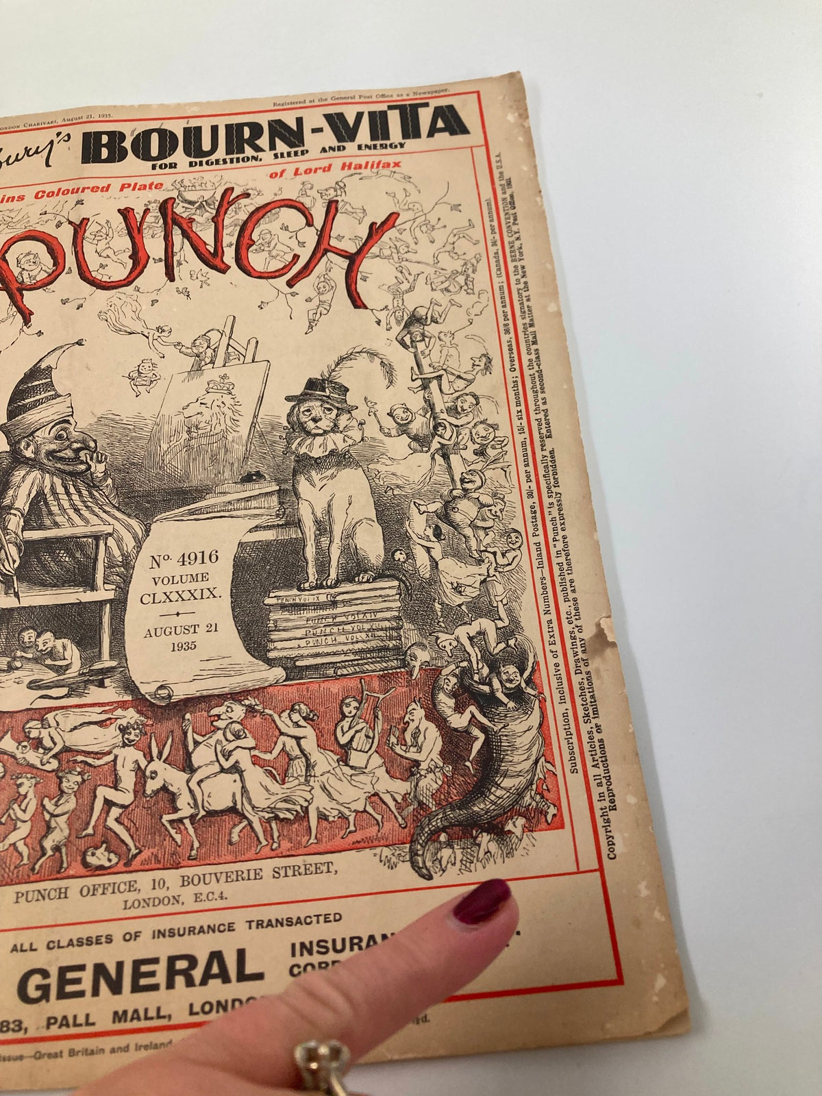 Close-up of the Vintage Punch Magazine from August 21, 1934, highlighting detailed illustrations and the magazine's wear, emphasizing its unique character.
