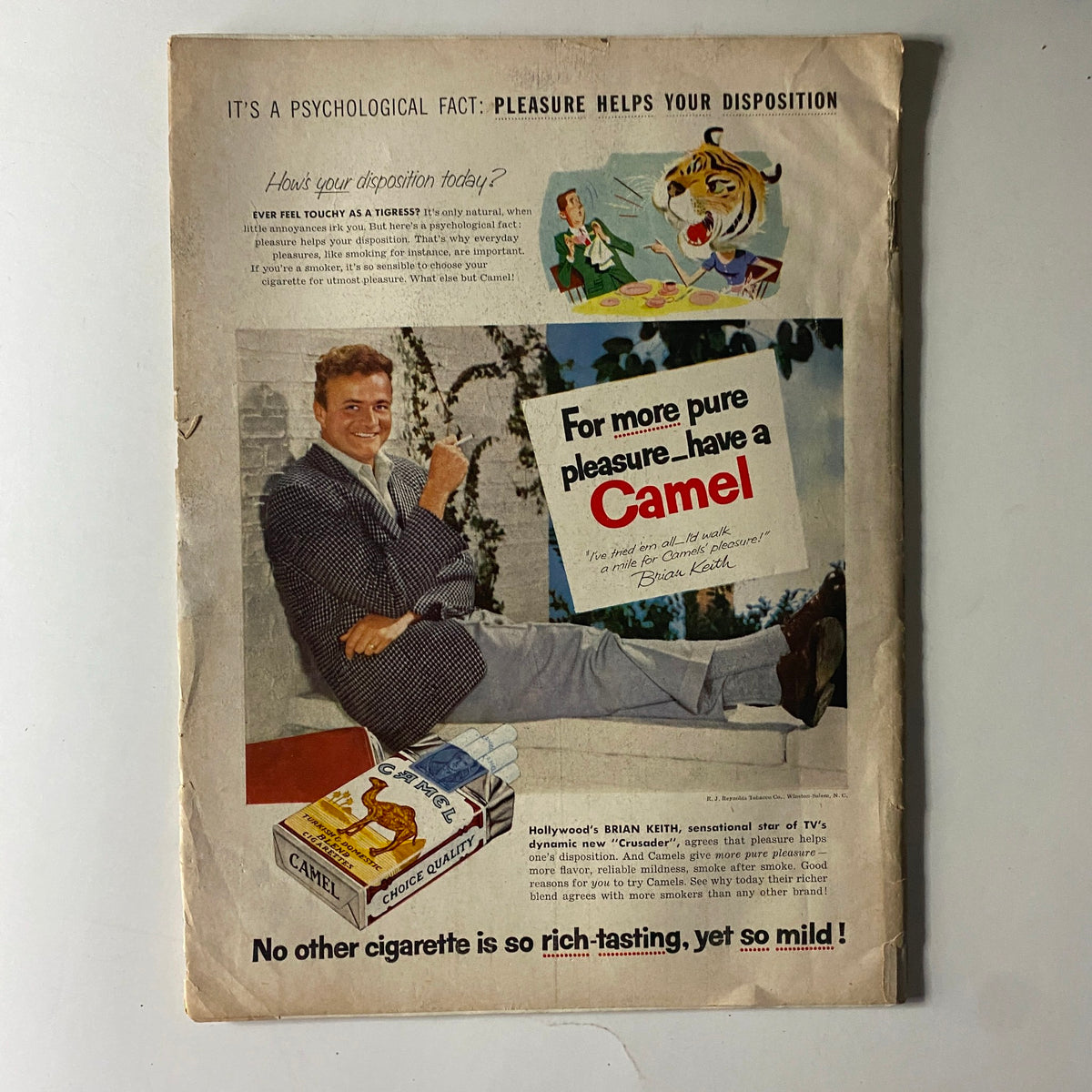 Back cover of The American Legion Magazine October 1955, featuring a vintage advertisement for Camel cigarettes with actor Brian Keith, highlighting the appeal of pleasure and leisure in the 1950s.