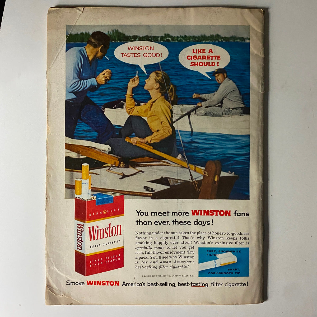 Advertisement for Winston cigarettes from The American Legion Magazine June 1957, showcasing people enjoying the outdoors while promoting Winston's tagline 'Winston tastes good!'