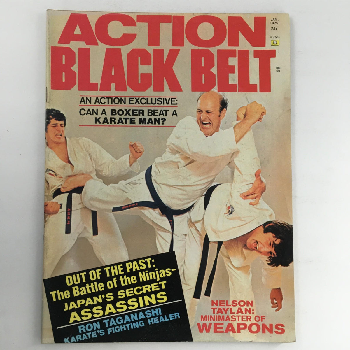 Cover of Action Black Belt Magazine January 1975 featuring an action scene with martial artists in dynamic poses. The magazine highlights an exclusive article questioning if a boxer can beat a karate man, showcasing the martial arts culture of the 1970s.