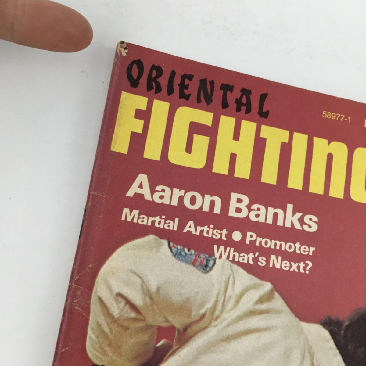 Close-up view of the cover of Oriental Fighting Arts Magazine Oct-Nov 1974, highlighting the title and Aaron Banks as a martial artist and promoter.