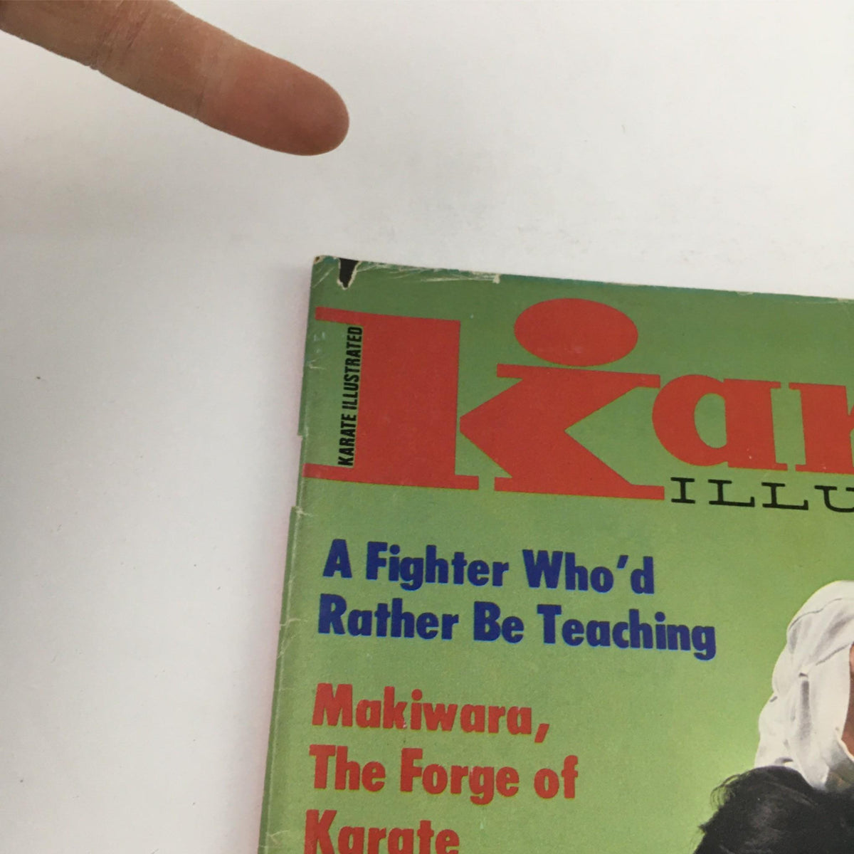 Close-up of the title on the cover of Karate Illustrated Magazine January 1980, showcasing the phrase 'A Fighter Who'd Rather Be Teaching' along with other featured articles.