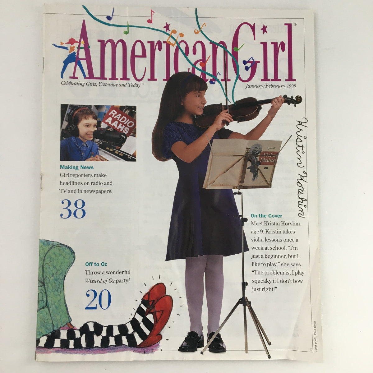 Cover of American Girl Magazine January February 1998 featuring Kristin Korshin playing the violin. The magazine highlights stories and themes, including an Off To Oz party and articles related to girls' creativity and adventures.