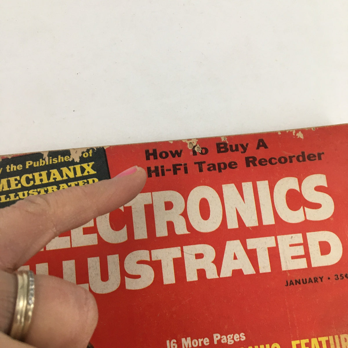 Close-up of Electronics Illustrated Magazine January 1960 highlighting the title and subtitle sections about Hi-Fi tape recorders, with visible wear on the cover.