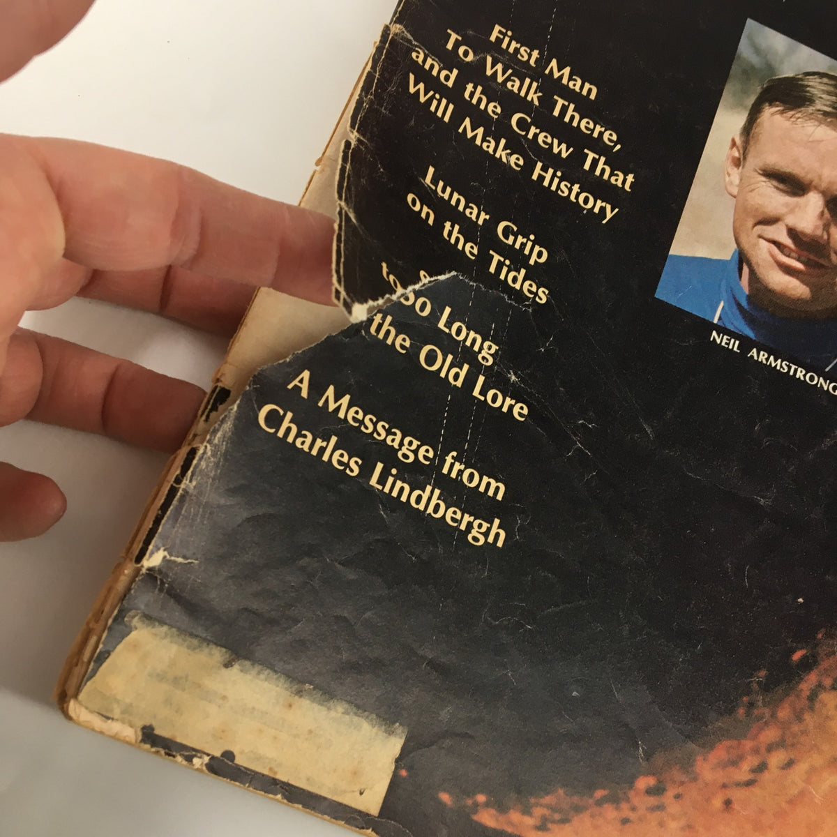 Close-up view of the cover of VTG Life Magazine July 4 1969 showing Neil Armstrong and the magazine's title, detailing the first man to walk on the moon and other historical features.