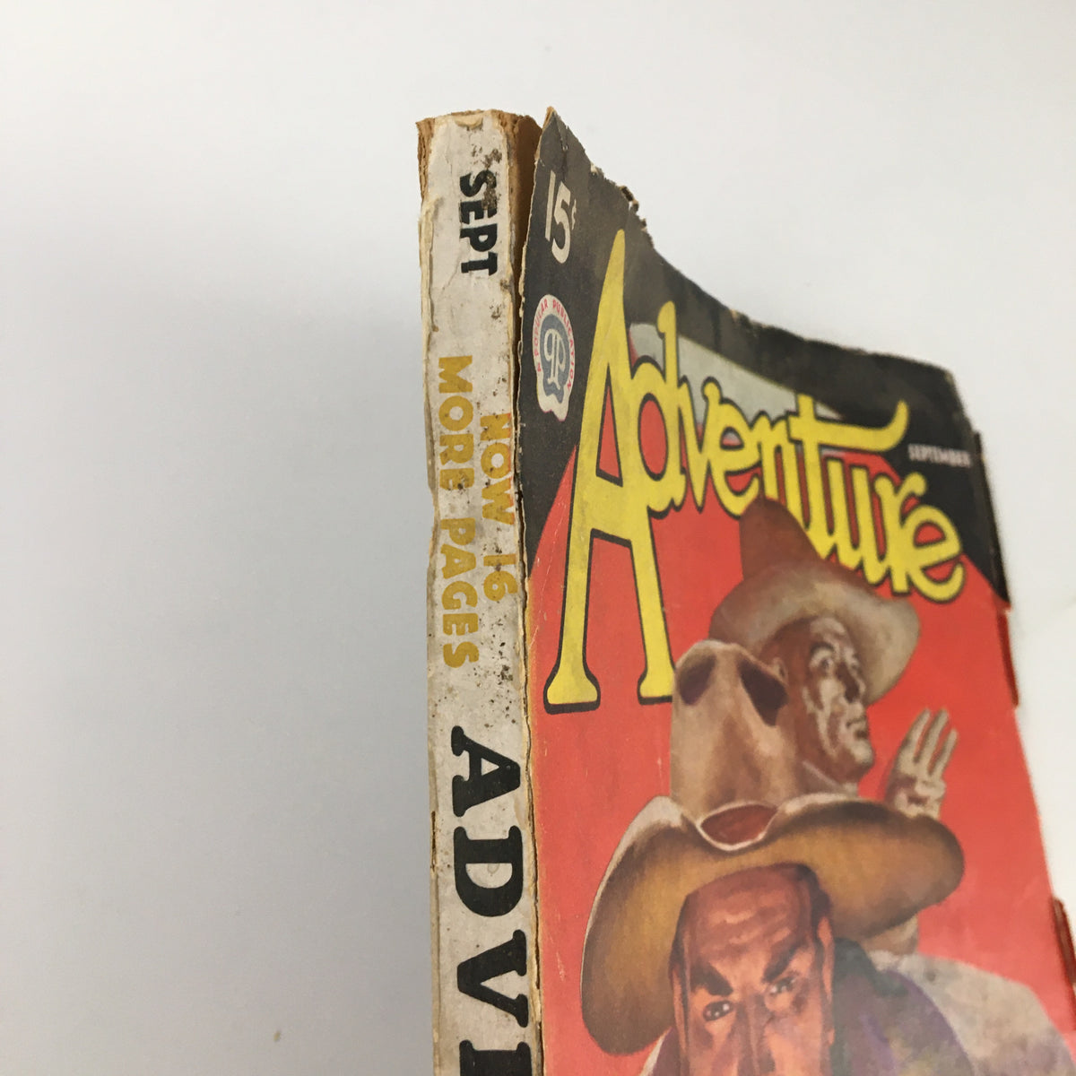 Side view of the VTG Adventure Magazine September 1937, highlighting the worn spine and vintage details.