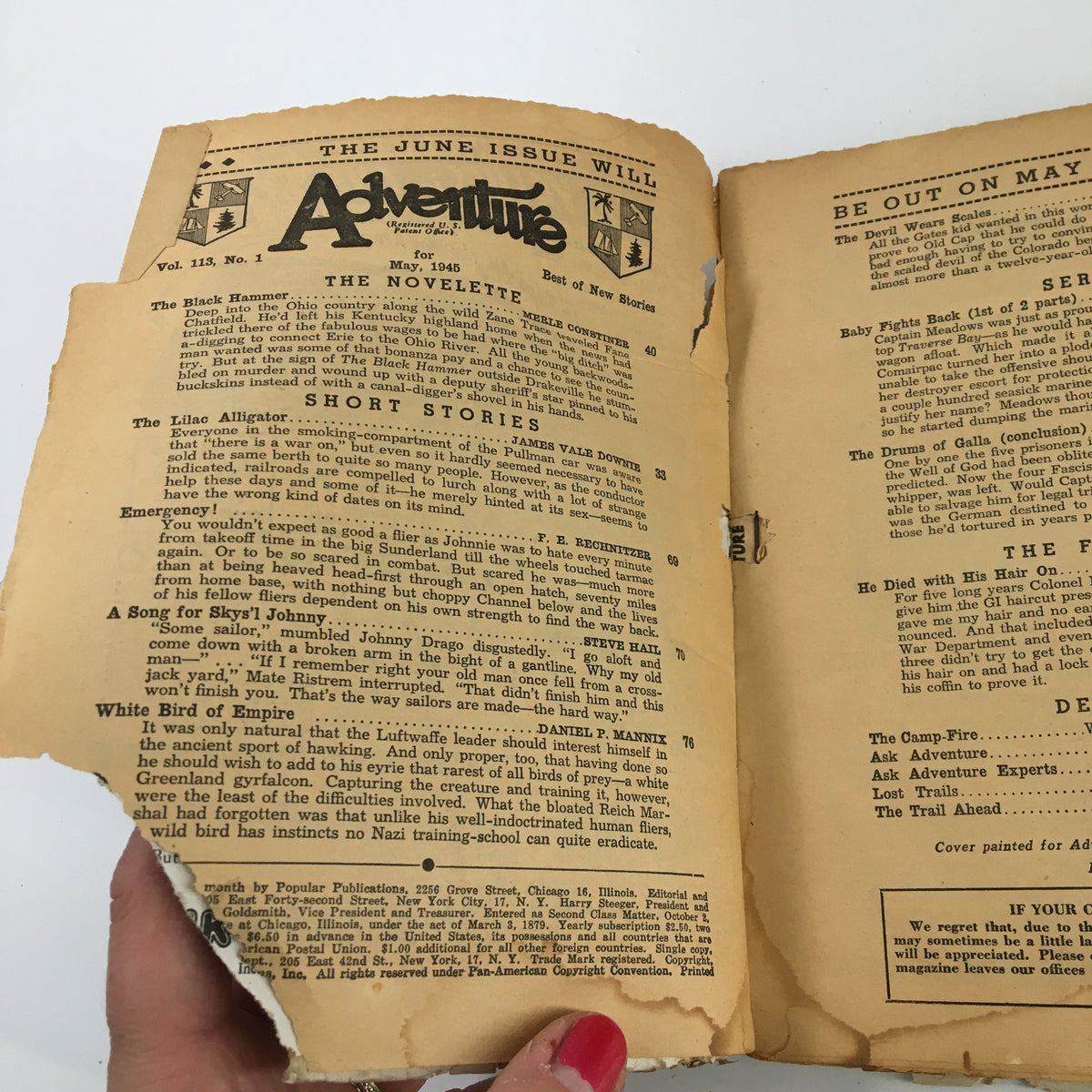 Inside page of VTG Adventure Magazine May 1945 featuring the novelette title 'The Black Hammer' with aged paper and visible tears, reflecting its vintage condition and providing insight into classic short stories.