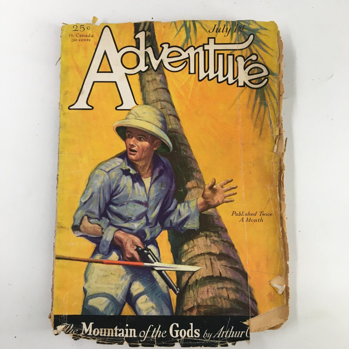 Cover of VTG Adventure Magazine July 1945 featuring a man with a machete in a tropical setting, showcasing the title "Adventure" and the novel "The Mountain of the Gods."