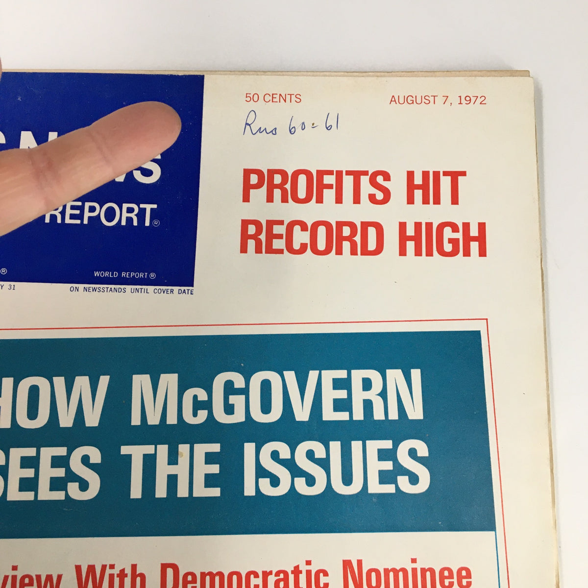 Close-up of the cover of US News & World Report Magazine, August 7, 1972, showing the title 'How McGovern Sees the Issues' with additional details on profits and a finger emphasizing a handwritten note.