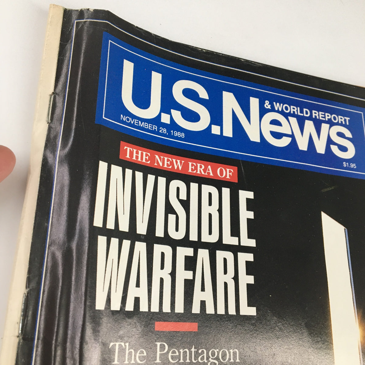 Close-up view of U.S. News & World Report magazine cover dated November 24, 1988, showcasing the title 'The New Era of Invisible Warfare' with emphasis on military themes.