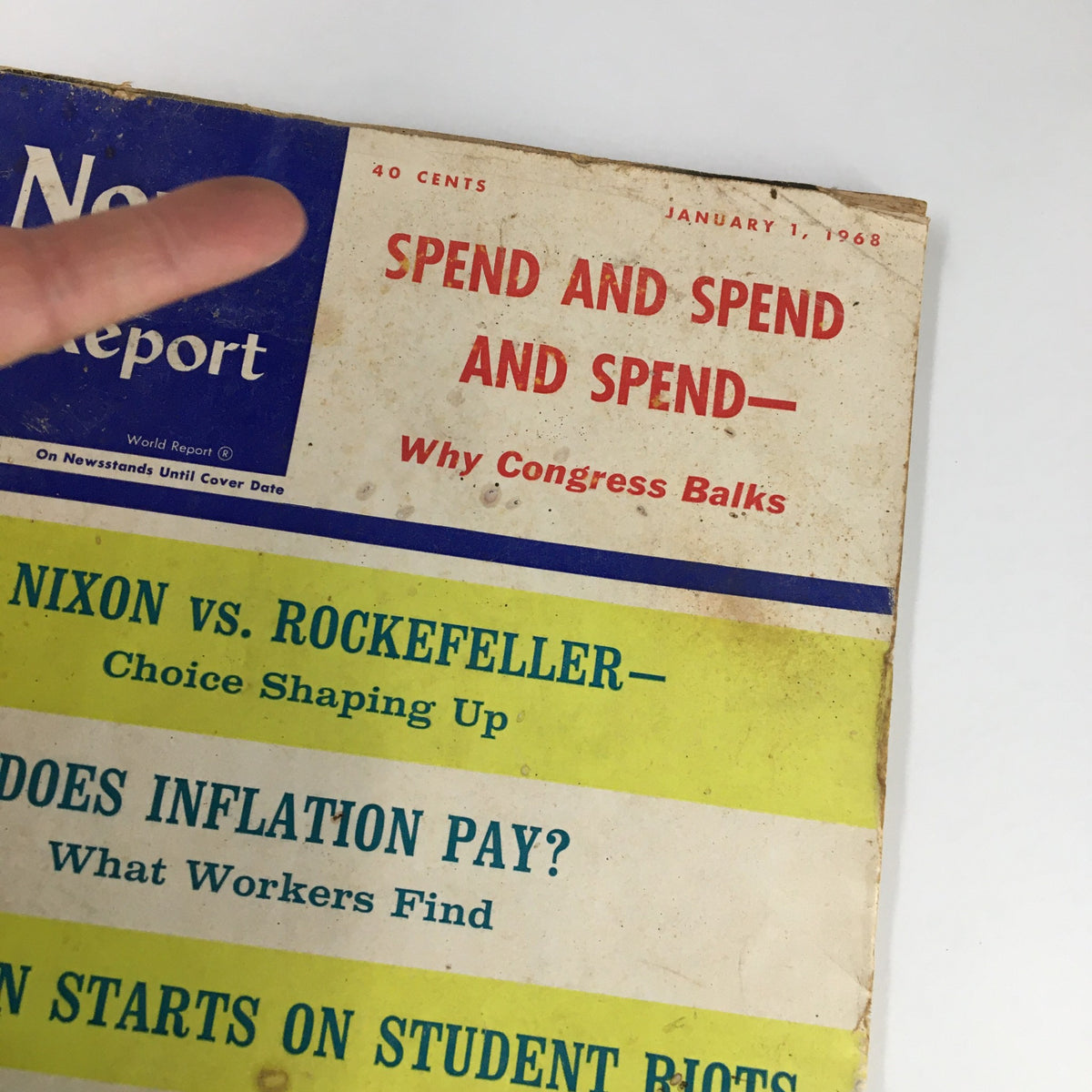 Detailed view of the cover of US News & World Report Magazine January 1, 1968 highlighting major topics including Nixon vs. Rockefeller and economic issues.