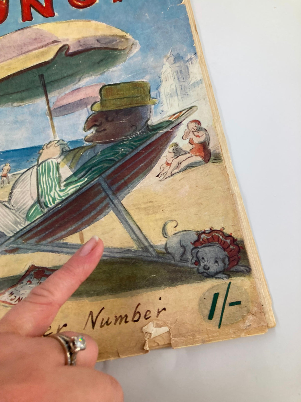 Close-up of the VTG Punch Magazine May 25 1955 Summer Number cover, highlighting a cartoon character in a hat lounging on a deck chair, with details of a playful dog and beach setting.