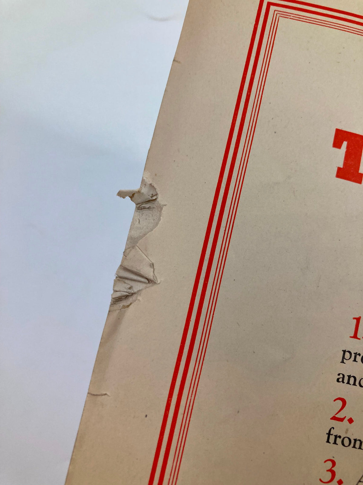 Close-up view of the VTG Punch Magazine July 9 1941 showing wear and tear, including creases and a small tear, highlighting its vintage character.