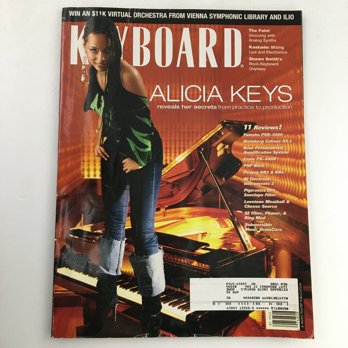 Cover of Keyboard Magazine December 2004 featuring Alicia Keys, showcasing her at a piano with a vibrant background, highlighting her secrets from music practice and production.