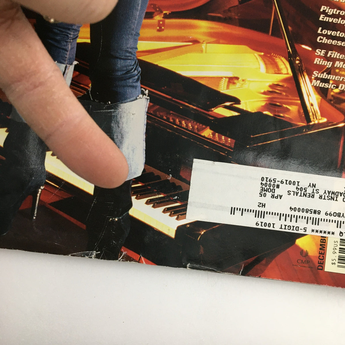Close-up detail of the Keyboard Magazine December 2004 cover featuring Alicia Keys, focusing on her boots and the piano, with an address label visible.