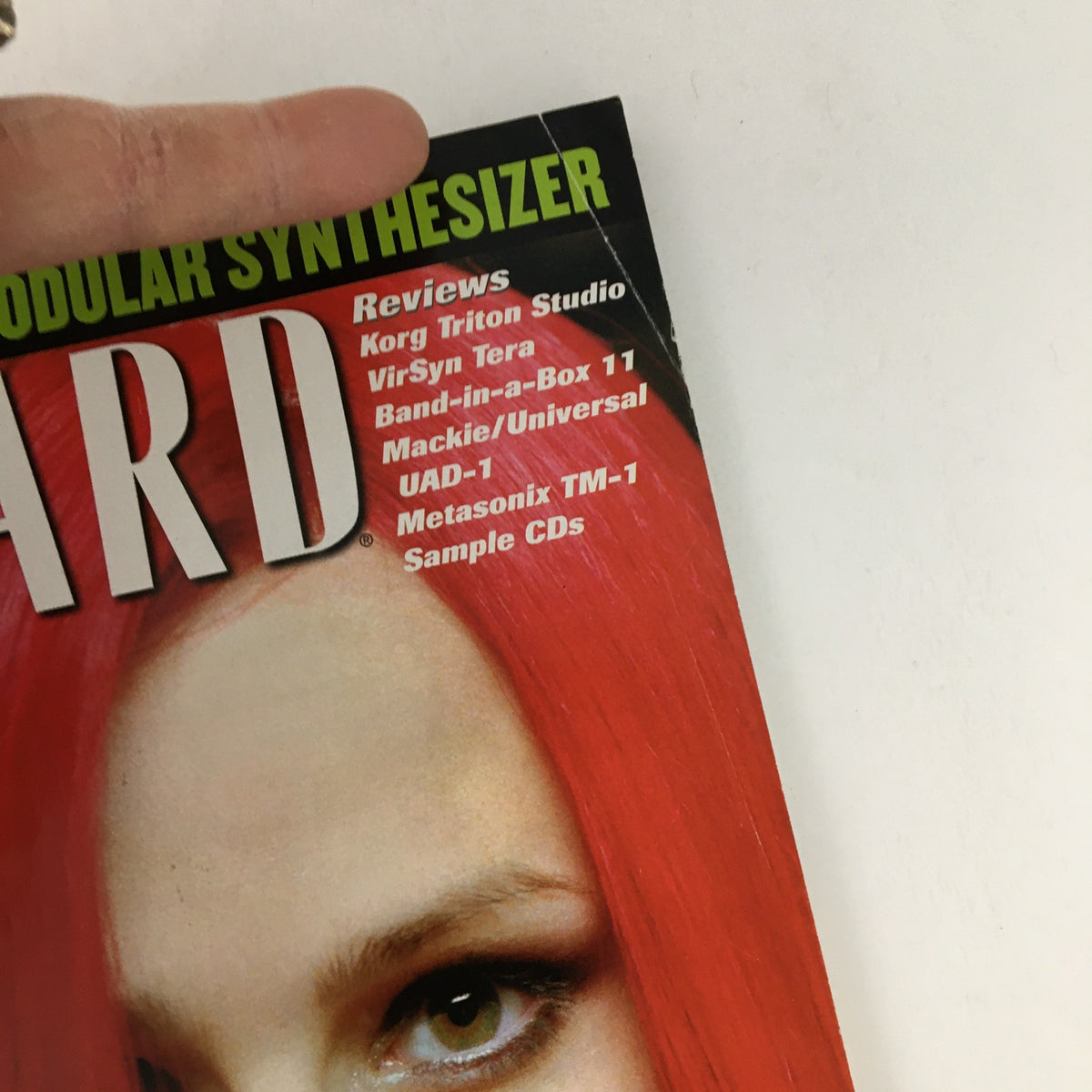 Close-up of the Keyboard Magazine July 2002 cover detailing, highlighting reviews and features related to music technology, with a focus on composer Michael Giacchino.