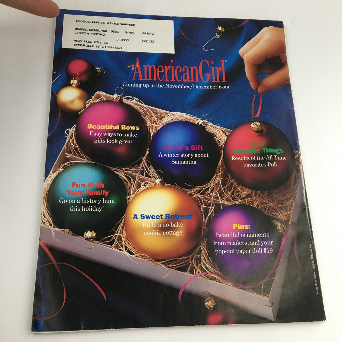 Back cover of American Girl Magazine September-October 1995, promoting upcoming November/December issue content with colorful ornaments and nostalgic holiday themes.