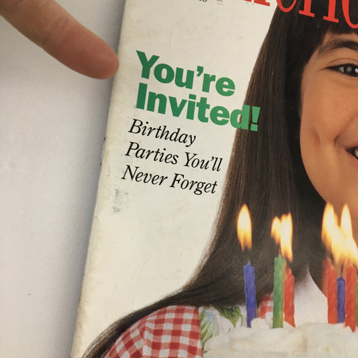 Close-up of the cover of American Girl Magazine May-June 1995, highlighting the text 'You’re Invited! Birthday Parties You’ll Never Forget' with a girl and birthday cake.