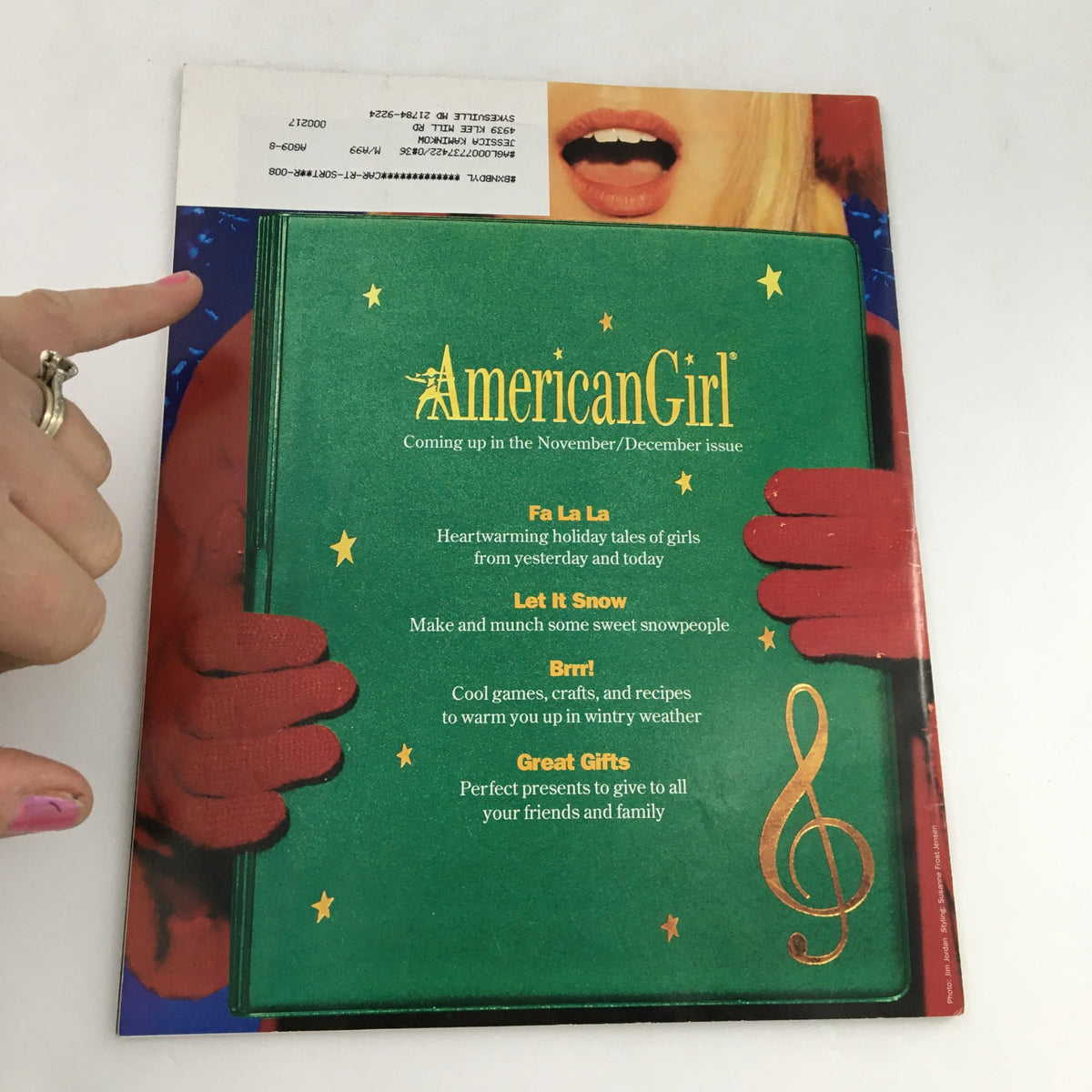 Back cover of American Girl Magazine September-October 1998 advertising upcoming November-December issue content, featuring green background and holiday themes.