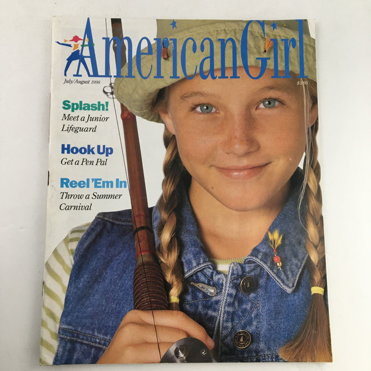 Cover of American Girl Magazine July-August 1998 featuring a young girl with braids, smiling while holding a fishing rod. The issue includes stories like 'Meet a Junior Lifeguard' and highlights summer activities.