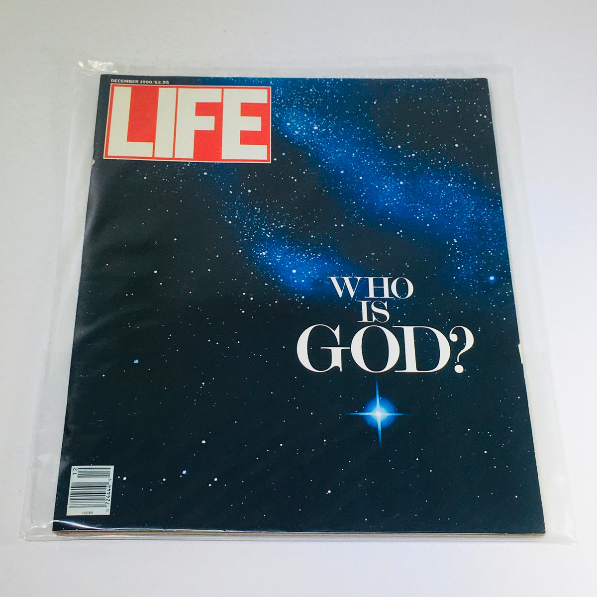 Vintage Life Magazine cover from December 1990 featuring the title 'Who Is God?' against a starry background, reflecting on faith and cultural questions of the time.