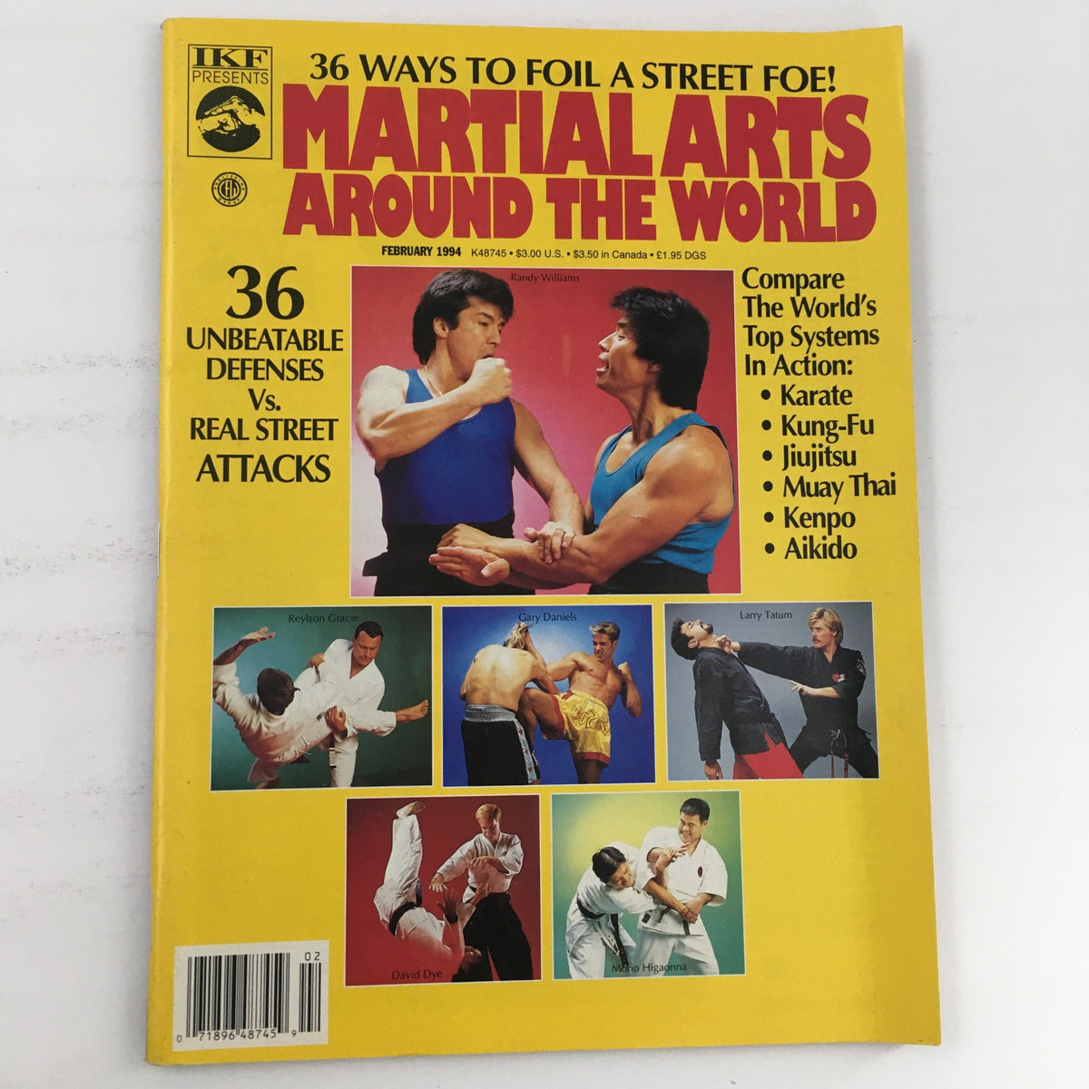 Cover of Martial Arts Around The World February 1994 featuring Raylson Gracie and Gary Daniels, showcasing martial arts defensive techniques against street attacks.