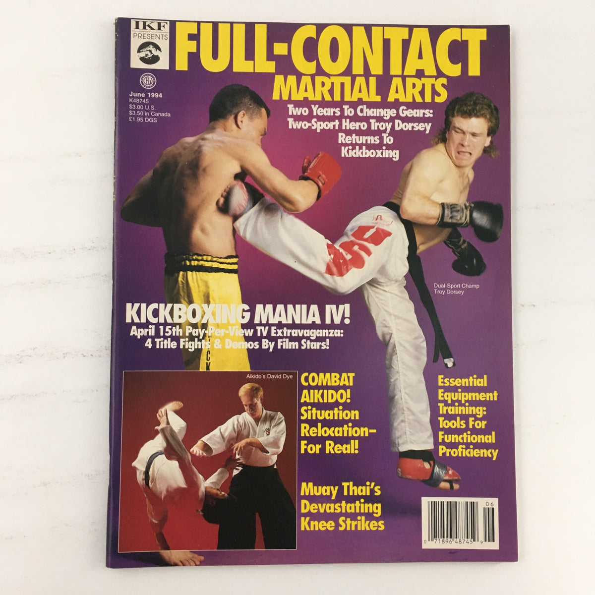 Cover of Full Contact Martial Arts Magazine June 1994 featuring Dual-Sport Champion Troy Dorsey, showcasing kickboxing dynamically. Highlights 'Kickboxing Mania IV' and combat aikido topics.