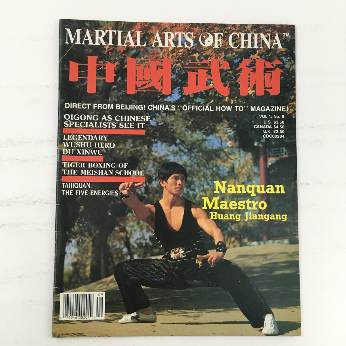 Martial Arts of China Magazine Volume 1 Number 9 from 1990 featuring Nanquan Maestro Huang Jiangang on the cover. The magazine highlights martial arts topics with vibrant imagery and a dynamic pose of the featured maestro.