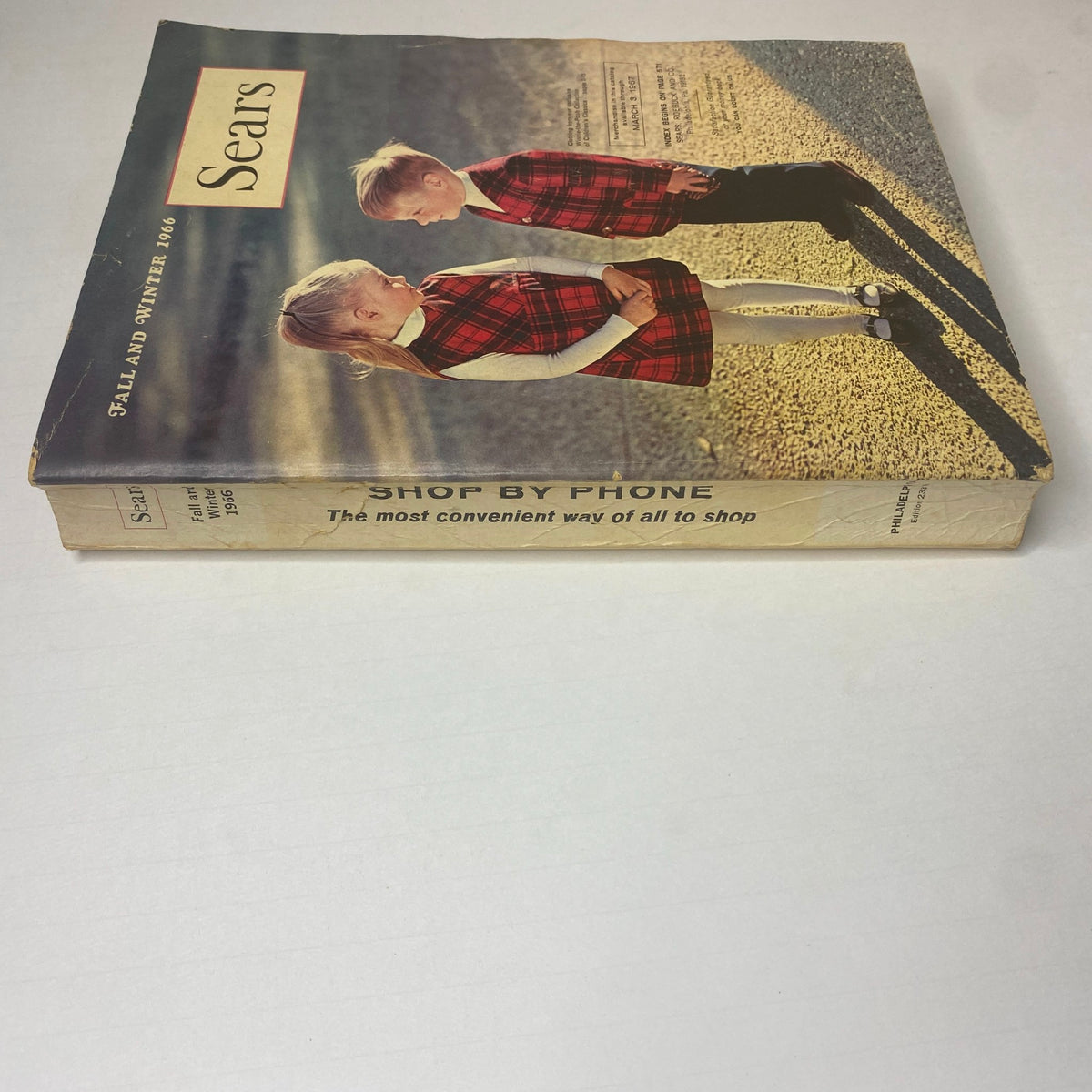 Spine view of the 1966 Sears Classic Fall and Winter Catalog, highlighting the title and promotional message about convenient phone shopping.