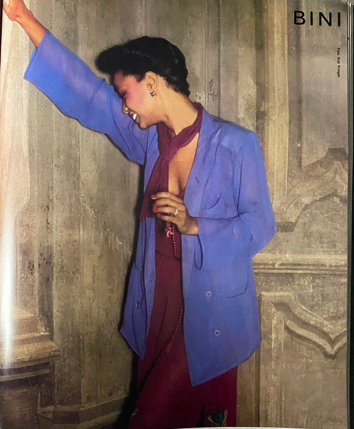 Elegant model in Vogue Paris April 1979 wearing a stylish blue blazer and maroon attire, showcasing haute couture fashion trends.