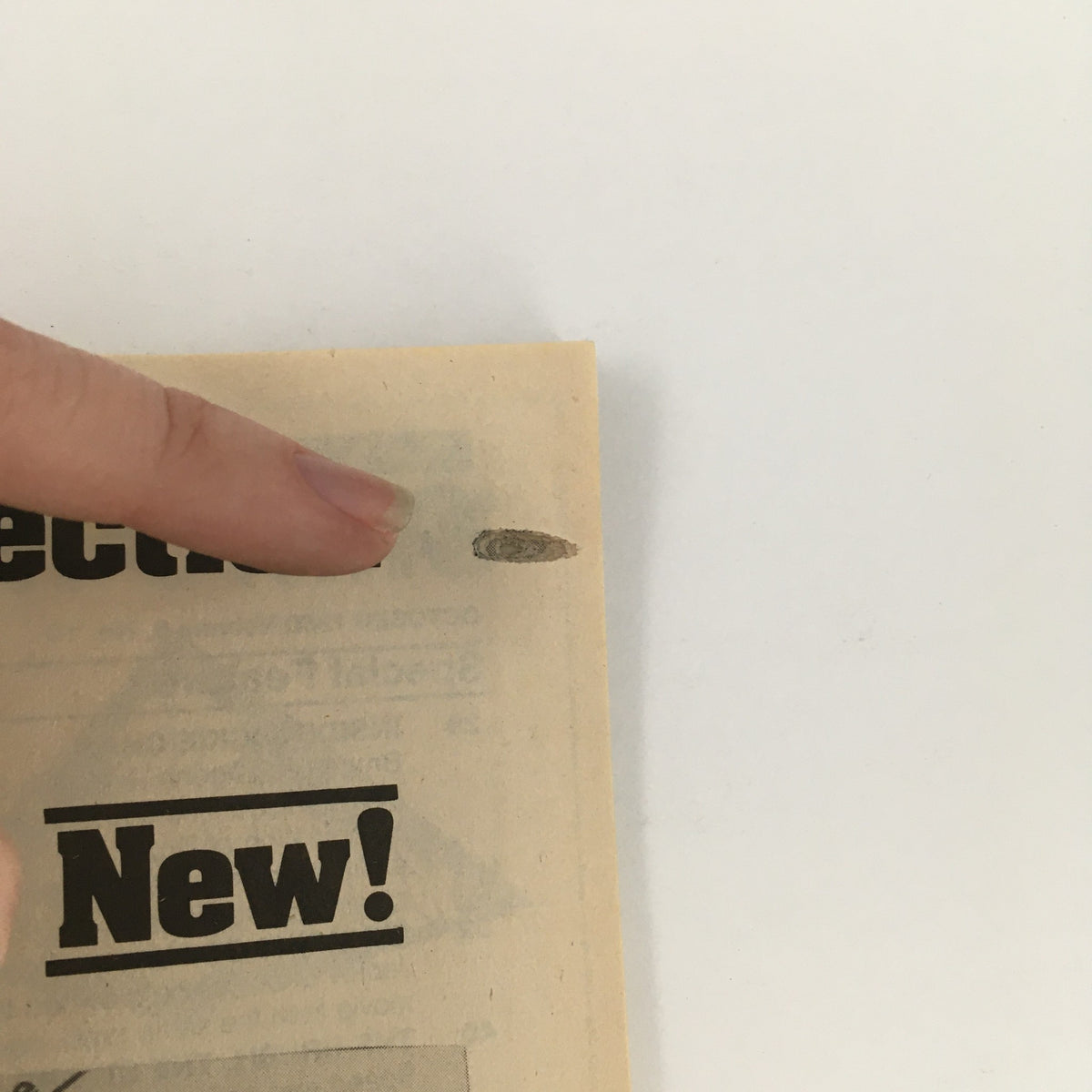 Detail of the Inside Kung Fu Magazine October 1980 Vol 6 #10 featuring Jackie Chan, showing a close-up of the magazine edge with visible wear and a finger pointing at it, highlighting the vintage condition.