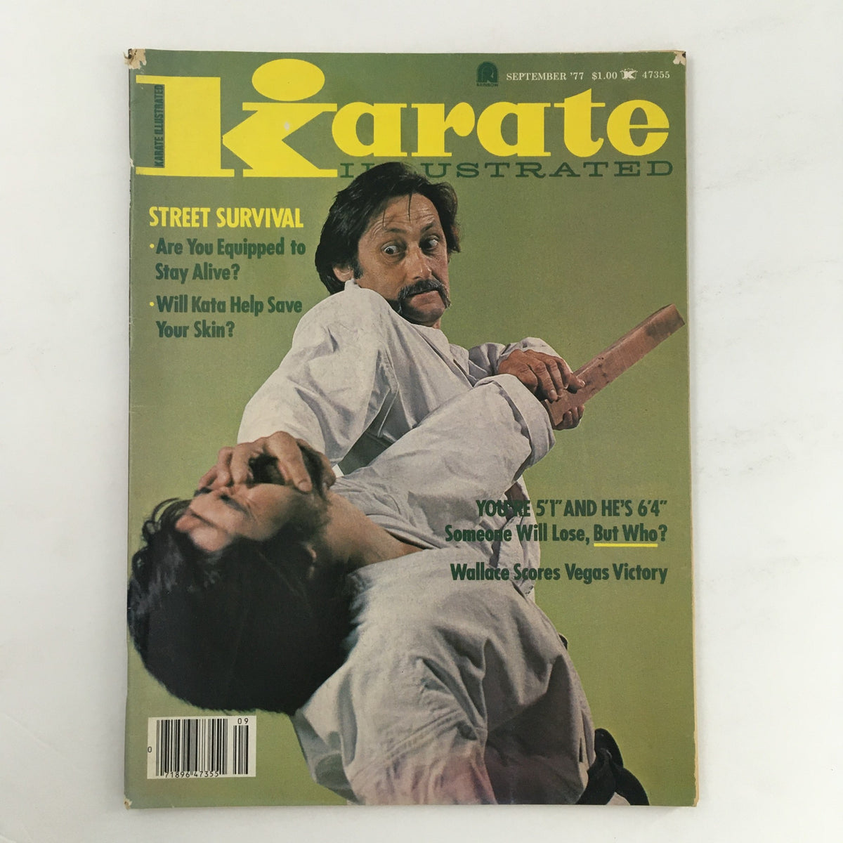 Cover of Karate Illustrated Magazine September 1977 Vol 8 #9 featuring an action shot with two martial artists, emphasizing street survival tips and karate techniques.