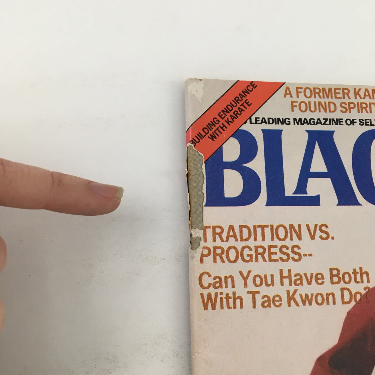 Side view of Black Belt Magazine, December 1978, showcasing wear and a prominent red sticker with the title 'Building Endurance with Karate'.