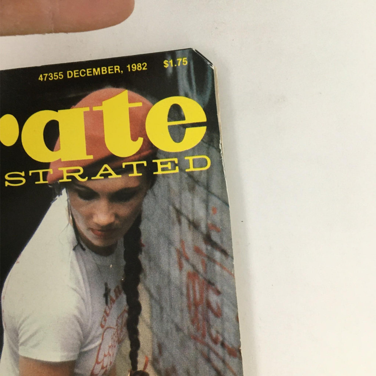 Close-up of the cover of Karate Illustrated Magazine December 1982 highlighting the title and distinctive red headband of a featured martial artist.