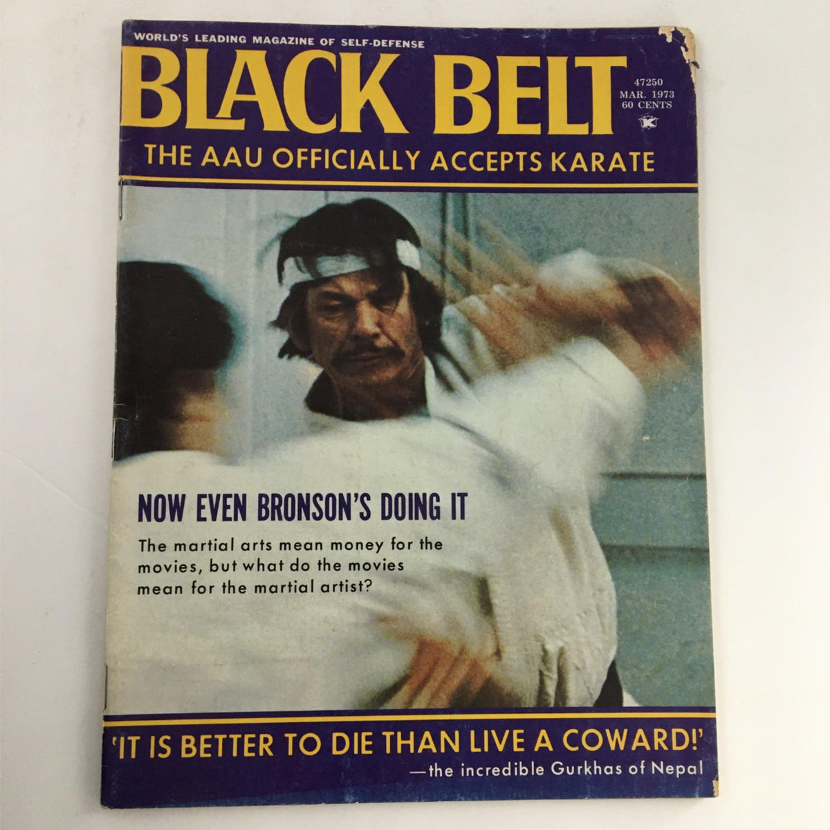 Black Belt Magazine March 1973 cover featuring Charles Bronson, showcasing martial arts themes and articles, with visible wear and damage.