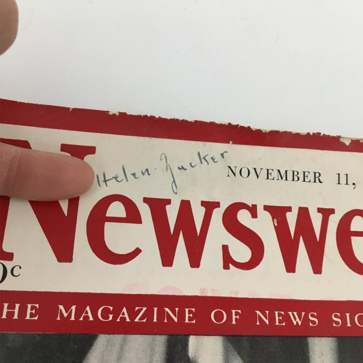 Close-up of the Newsweek Magazine from November 11, 1940 with the title 'What Roosevelt's Reelection Means to Nation', featuring a handwritten name on the cover, highlighting its vintage appeal.