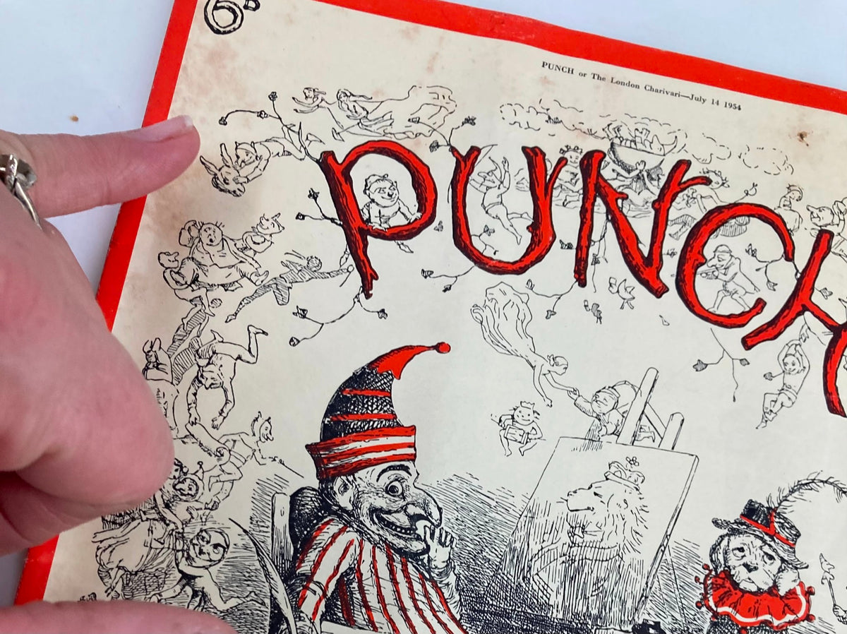 Close-up view of the VTG Punch Magazine July 14 1954 cover, highlighting the cartoon elements and detailed artwork surrounding the title PUNCH.
