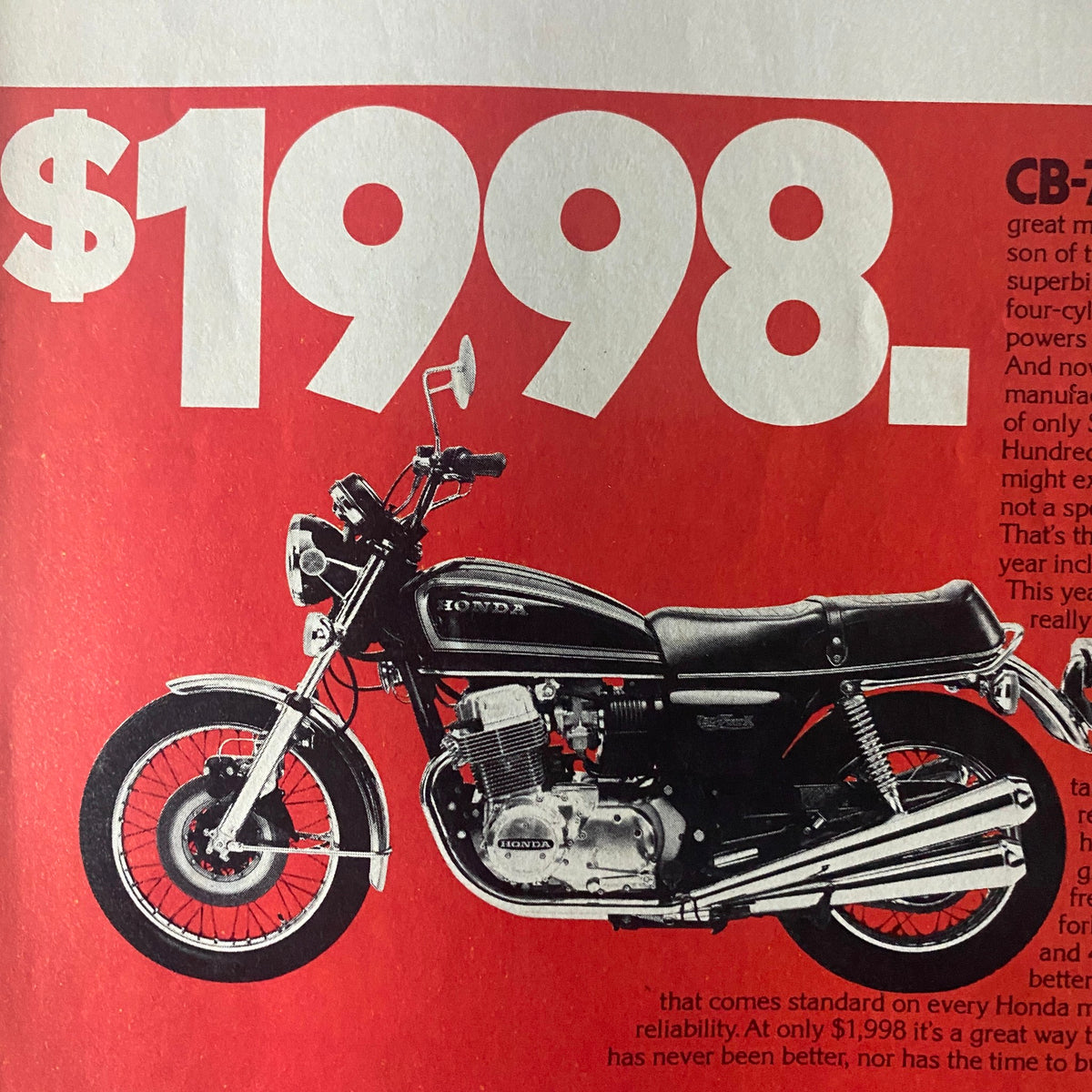 Cycle World Magazine February 1977 advertisement for Honda CB motorcycle priced at $1998, emphasizing features and value.