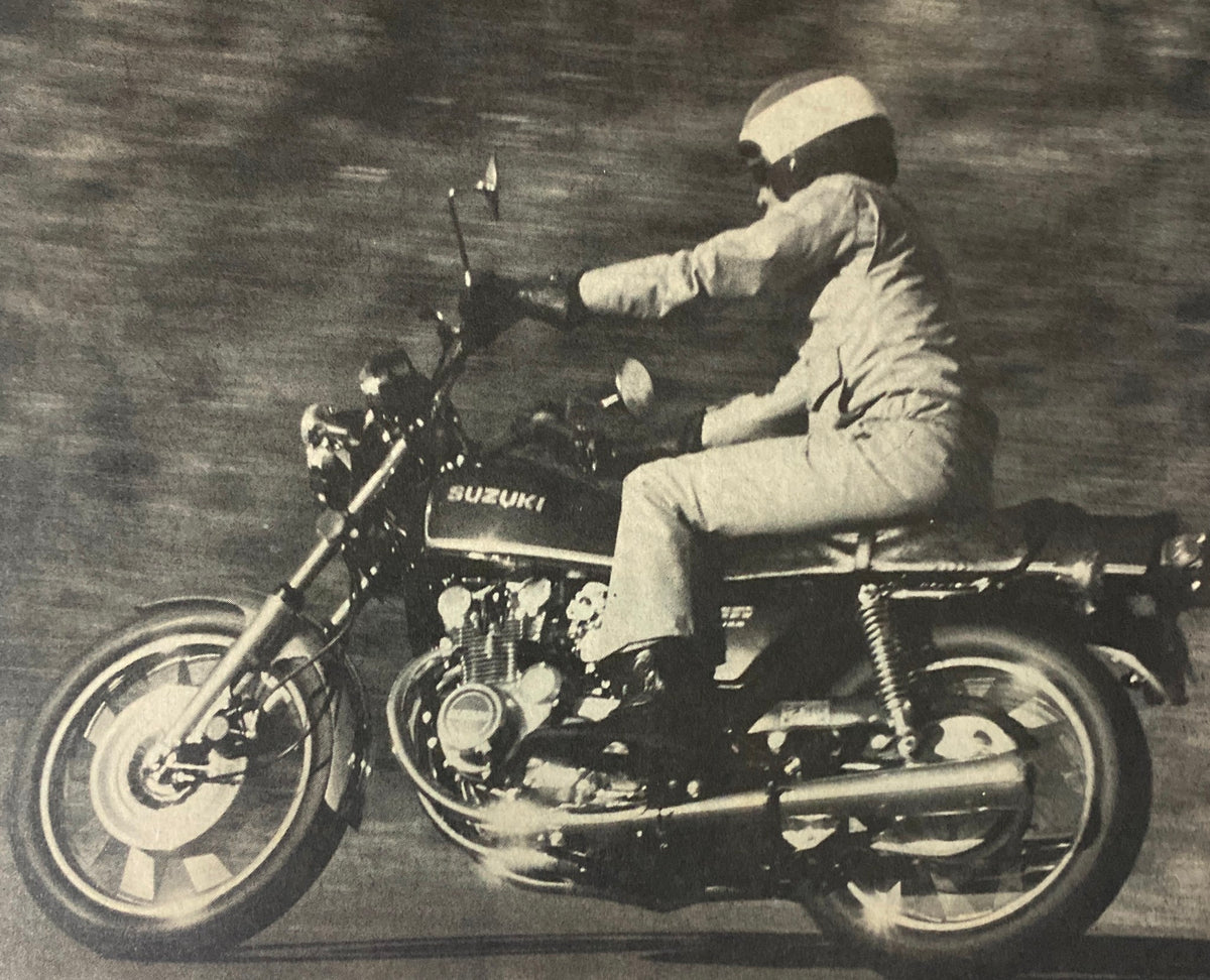 Vintage photo from Cycle World Magazine August 1977 showing a rider on a Suzuki motorcycle, illustrating the era's motorcycle performance.