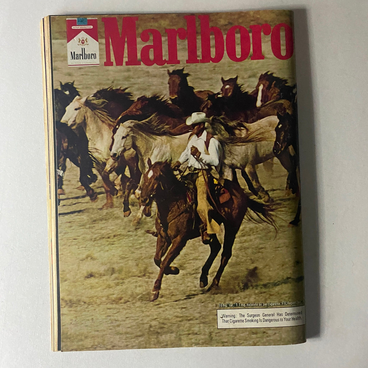 Marlboro magazine cover featuring a cowboy on horseback, showcasing a Western theme that complements the motorcycle culture in Cycle World Magazine August 1977.